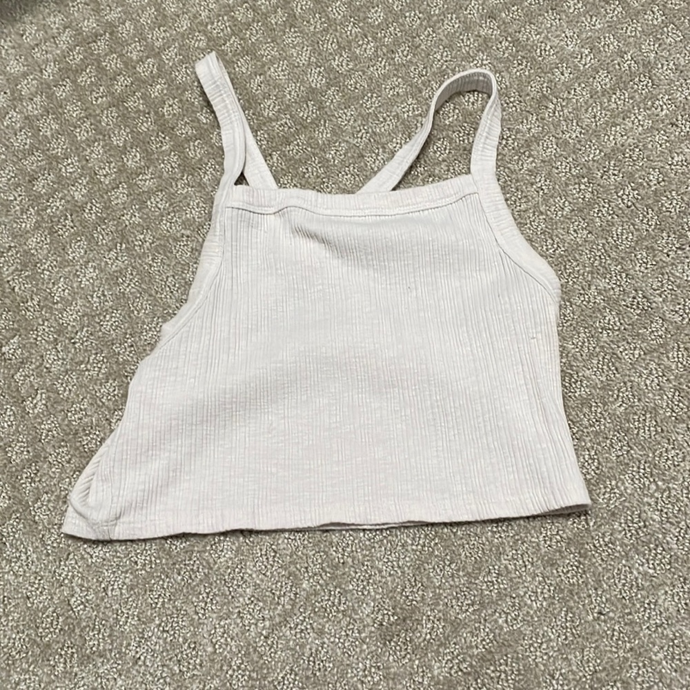 Cute crop top with criss cross back.